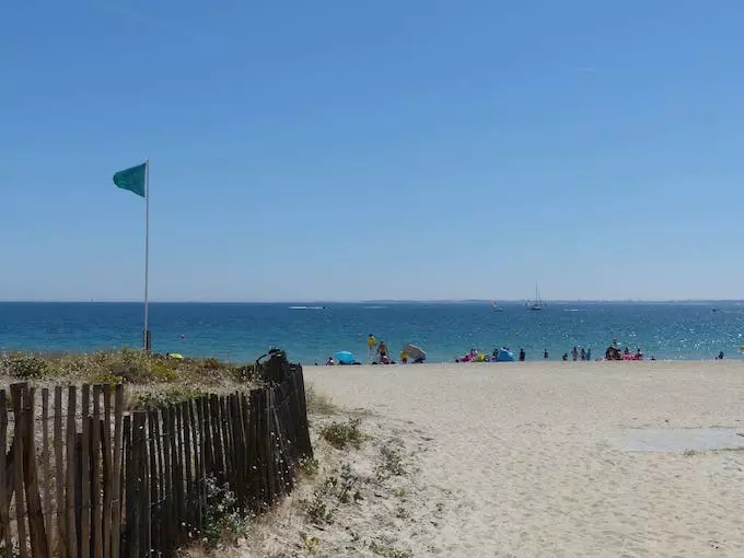 Entrance to the Grande Plage of Carnac, green bathing flag
