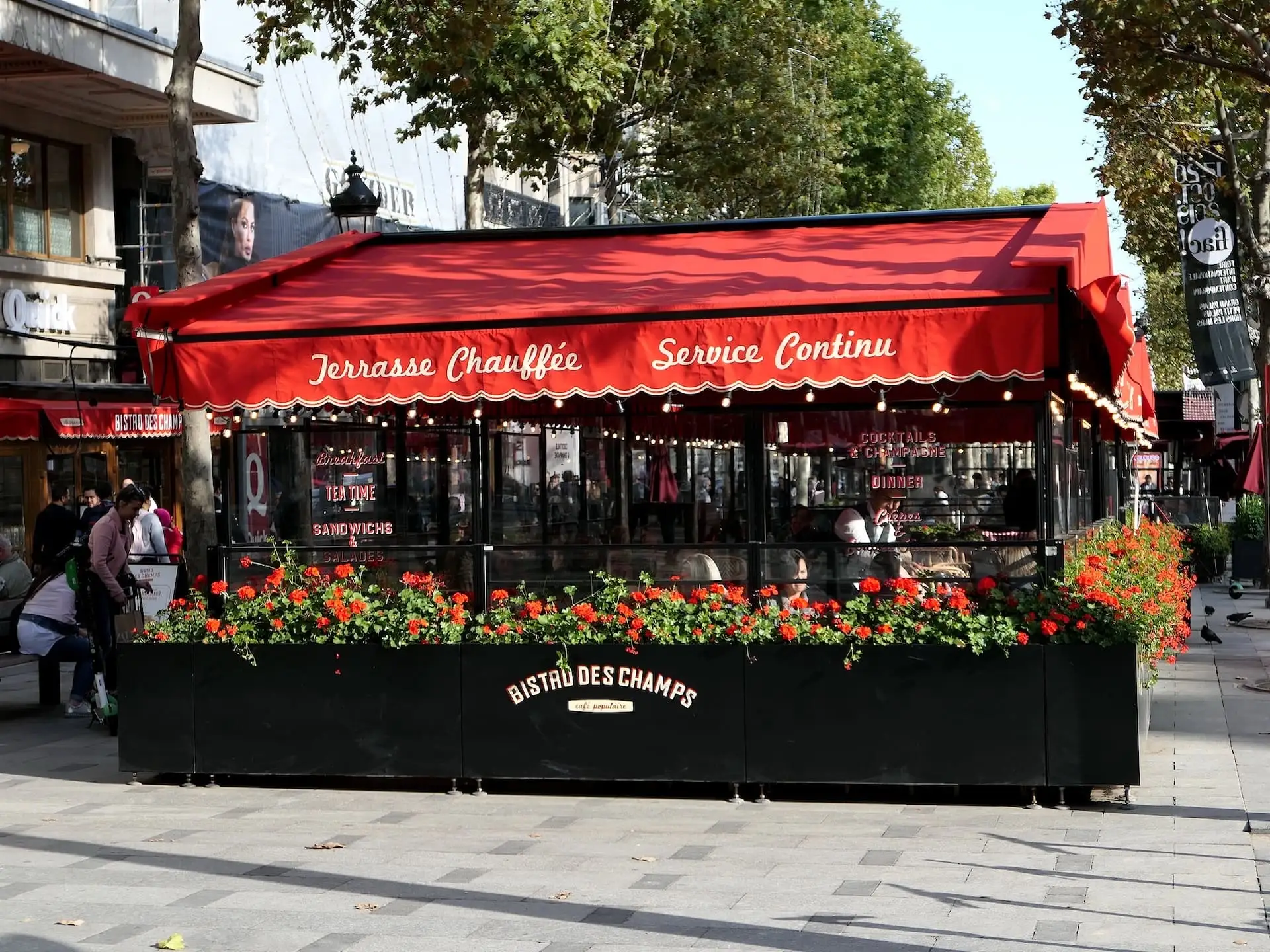 Red facade of a bistro on the Champs-Élysées