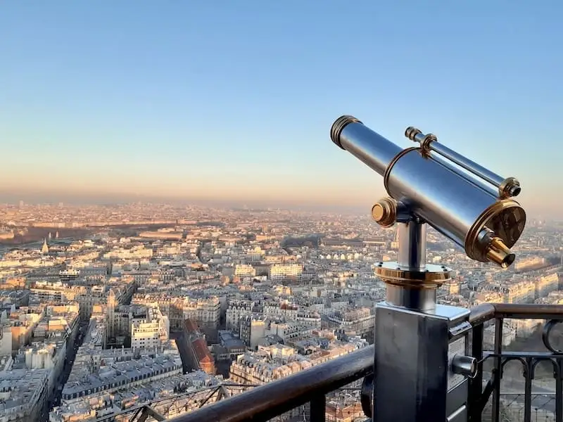 View from the Eiffel Tower Tourist telescopes with a view of Paris from the Eiffel Tower