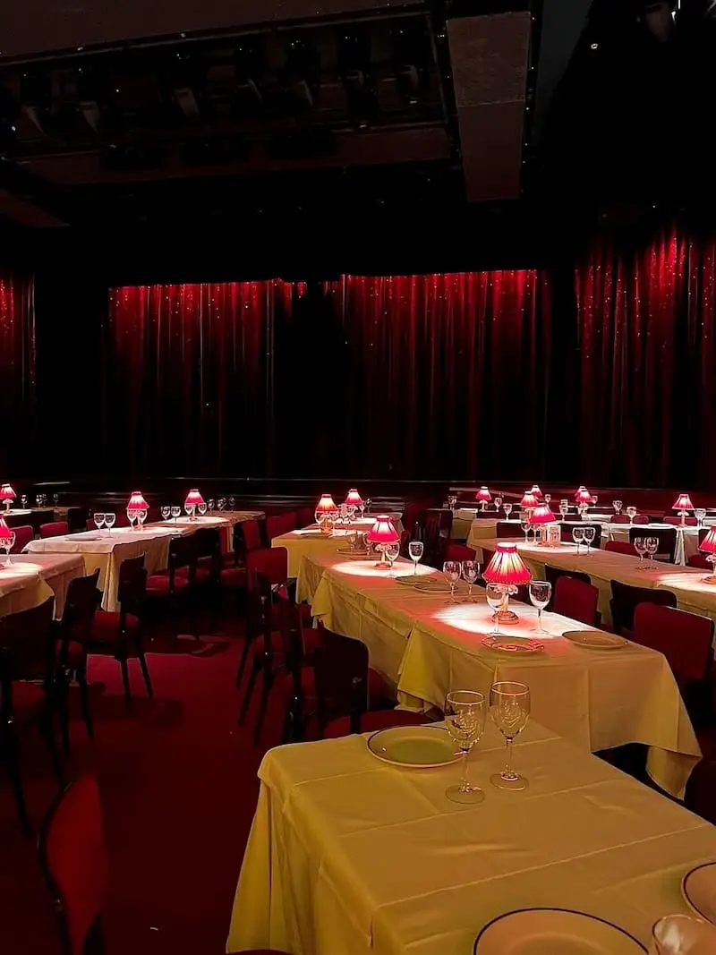 Dinner at the Moulin Rouge Dining tables set at the Moulin Rouge