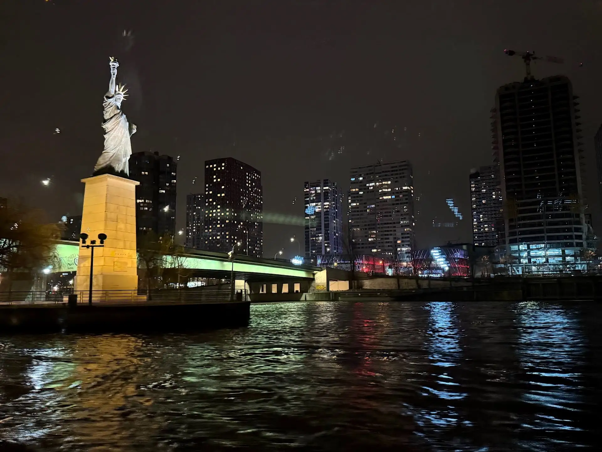 French Statue of Liberty on the Seine at night
